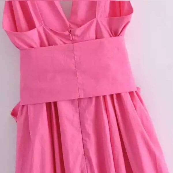 Vestido rosa con lazo grande sin mangas 7